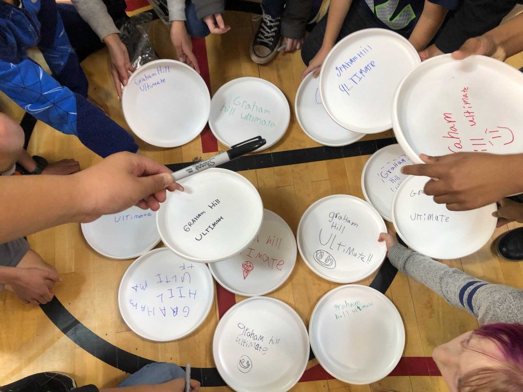 upside down frisbees that all read "graham hill elementary"