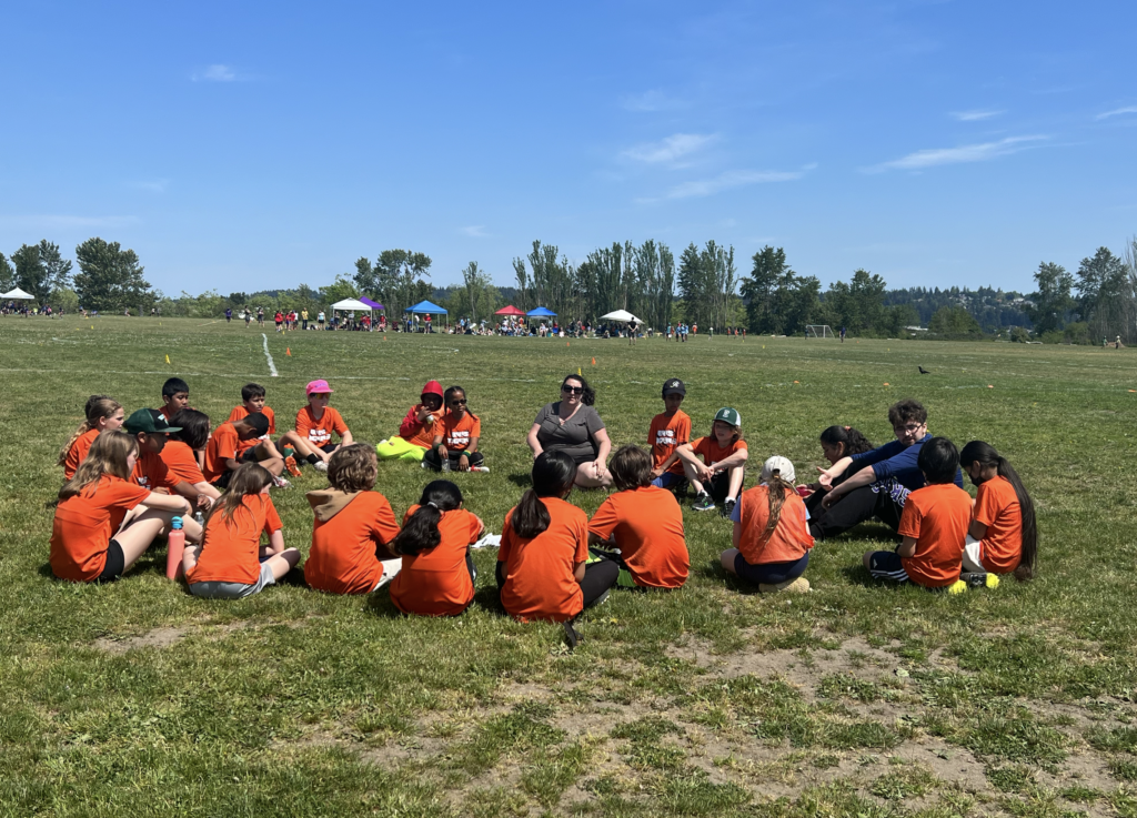 beacon hill los tigres ultimate team in a huddle after spring jam tournament